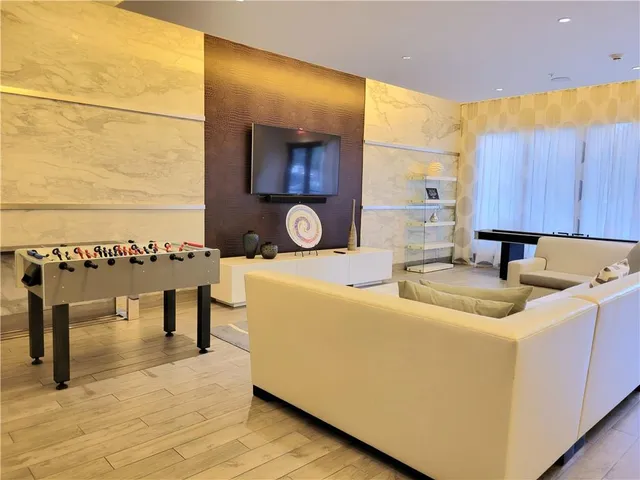 a living room with a sink and a table