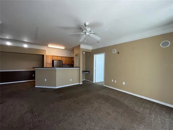 a view of a livingroom with a kitchen
