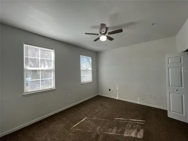 a view of empty room with windows