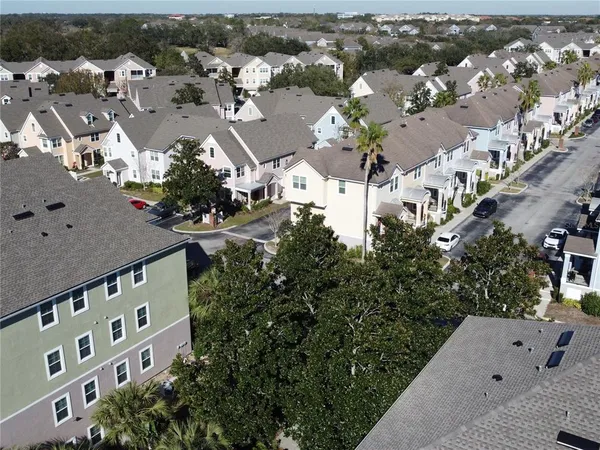 an aerial view of residential houses with outdoor space