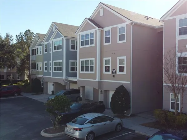 a front view of a house with yard glass top table and chairs