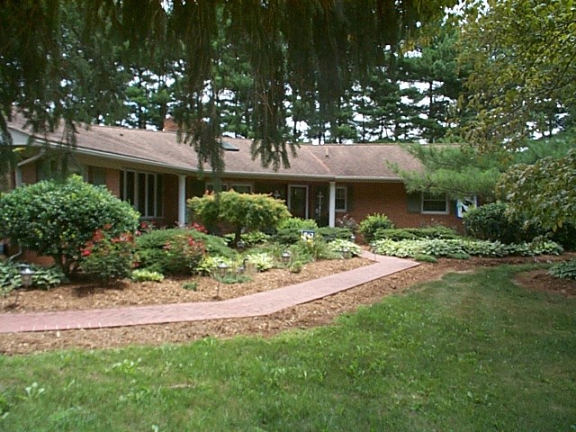 1541 Duke Road Waynesboro, VA 22980 - Photo 1 of 50 a front view of a house with a garden