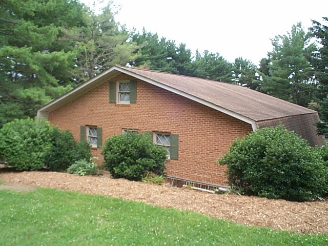 1541 Duke Road Waynesboro, VA 22980 - Photo 18 of 50 a view of a house with a yard plants and large tree