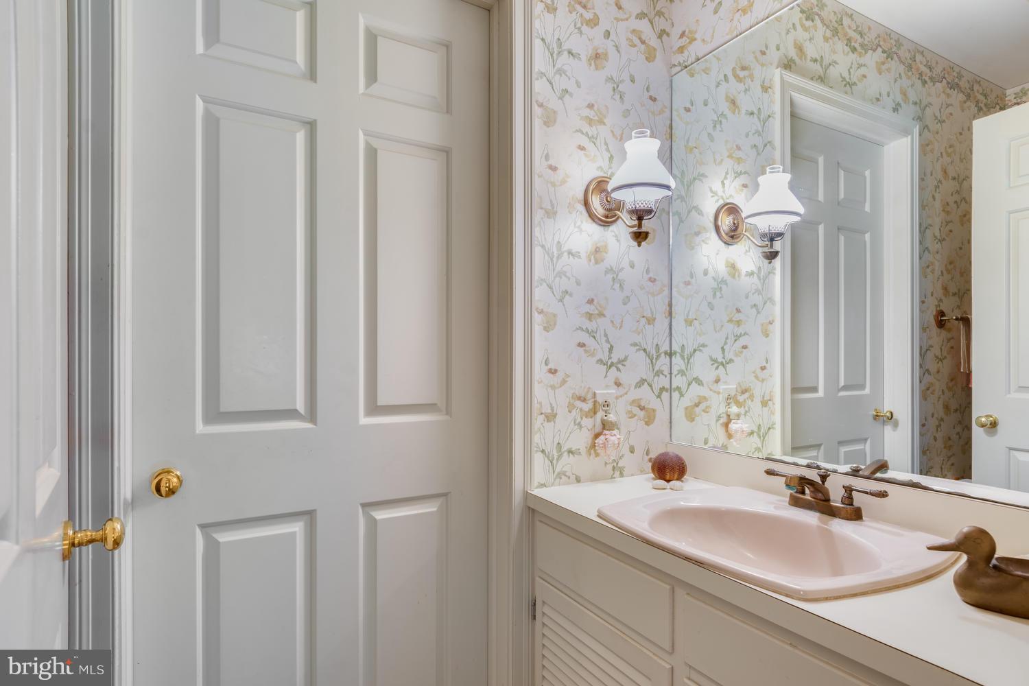 5031 Reed Road Oxford, MD 21654 - Photo 22 of 30 Powder Room and Laundry Room