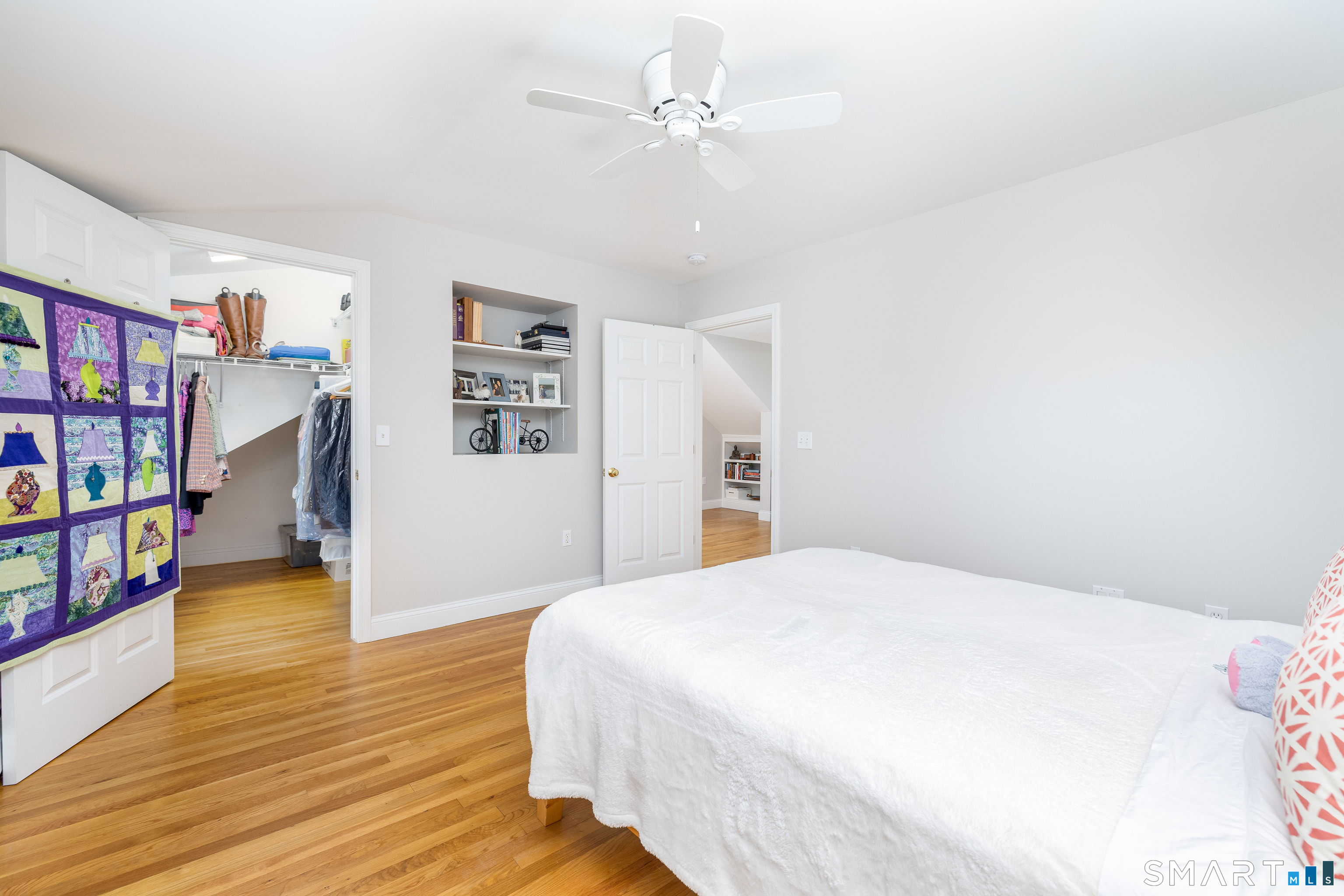 11 Sheldon Lane Litchfield, CT 06759 - Photo 21 of 33 a spacious bedroom with a bed and a book shelf
