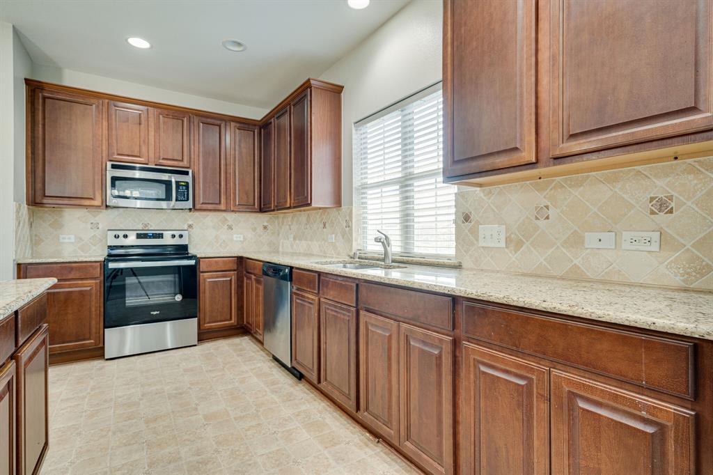 4016 Rome Court Irving, TX 75038 - Photo 13 of 24 Kitchen features tons of cabinets and granite countertops