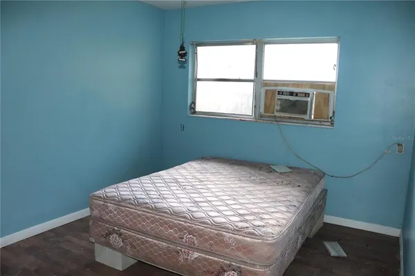 a room with a bed and a window