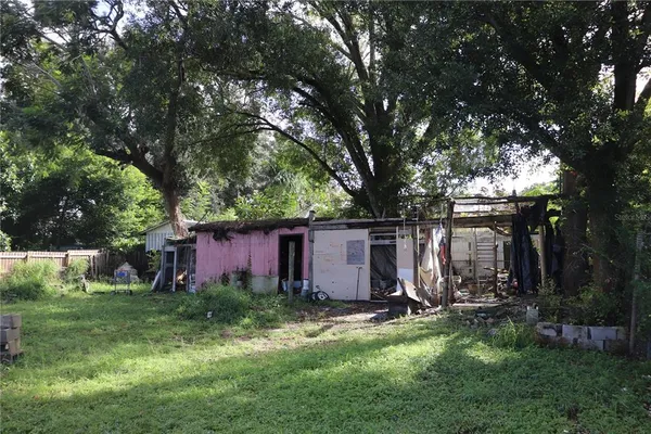 a backyard of a house with lots of green space