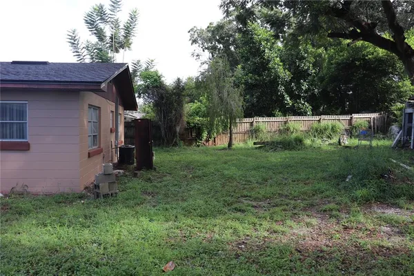 a backyard of a house with lots of green space
