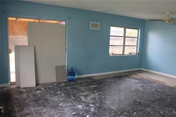 en empty room with windows