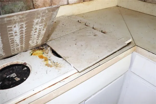 a utility room with a sink and washer