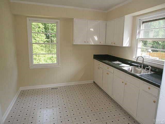920 Friar Tuck Road Raleigh, NC 27610 - Photo 1 of 1 a kitchen with granite countertop a stove a sink and a window