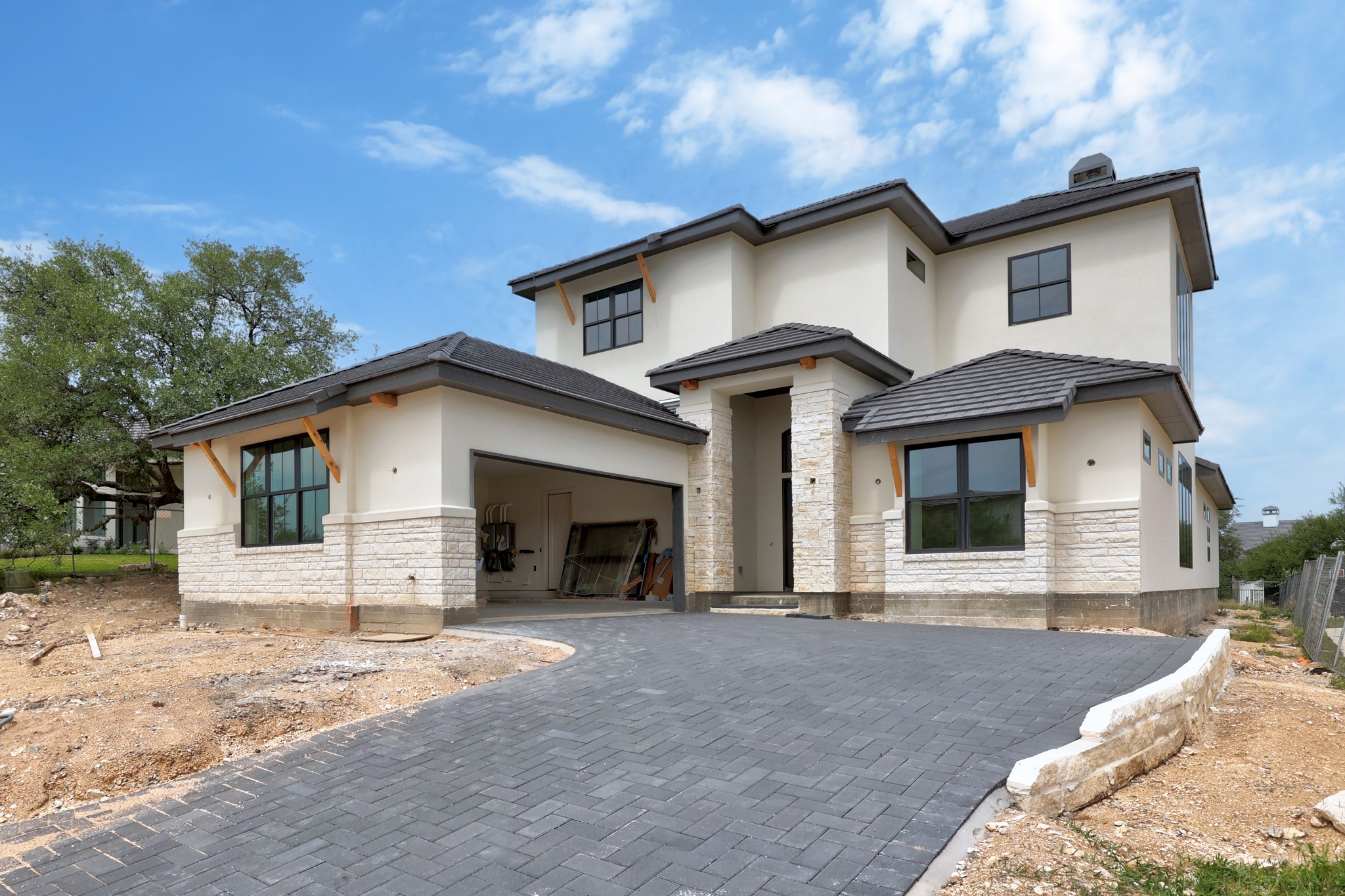 903 Flint Ridge Trail Georgetown, TX 78628 - Photo 1 of 39 Contemporary stucco and stone-clad exterior with a paved driveway