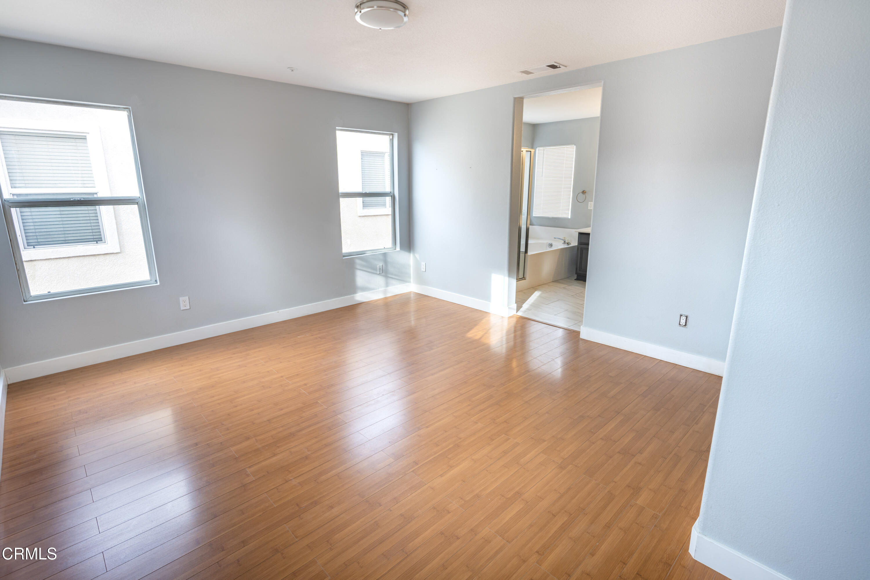 732 Pontoon Way Oxnard, CA 93035 - Photo 14 of 15 an empty room with wooden floor and windows