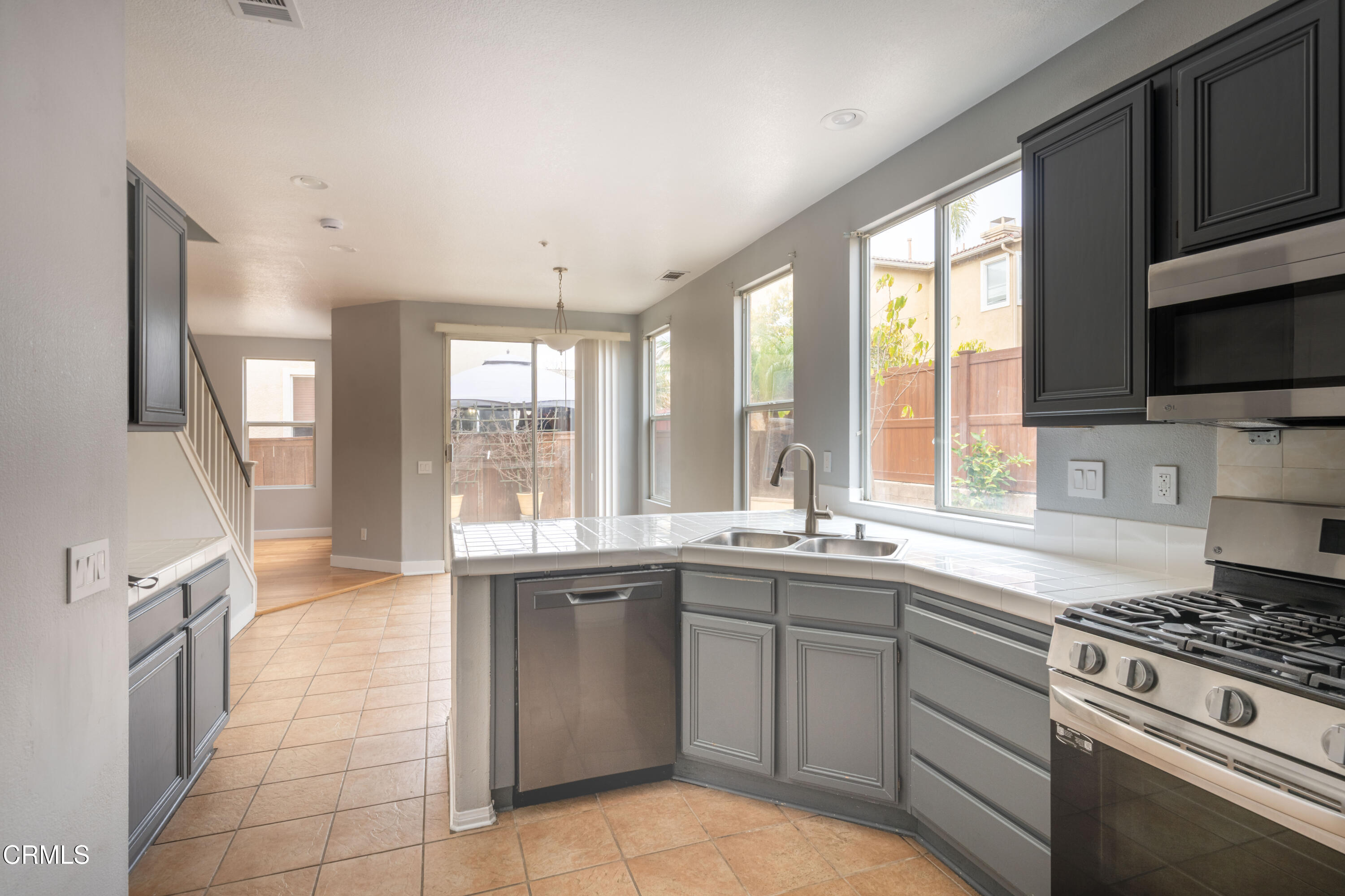 732 Pontoon Way Oxnard, CA 93035 - Photo 5 of 15 a kitchen with a sink stove and microwave