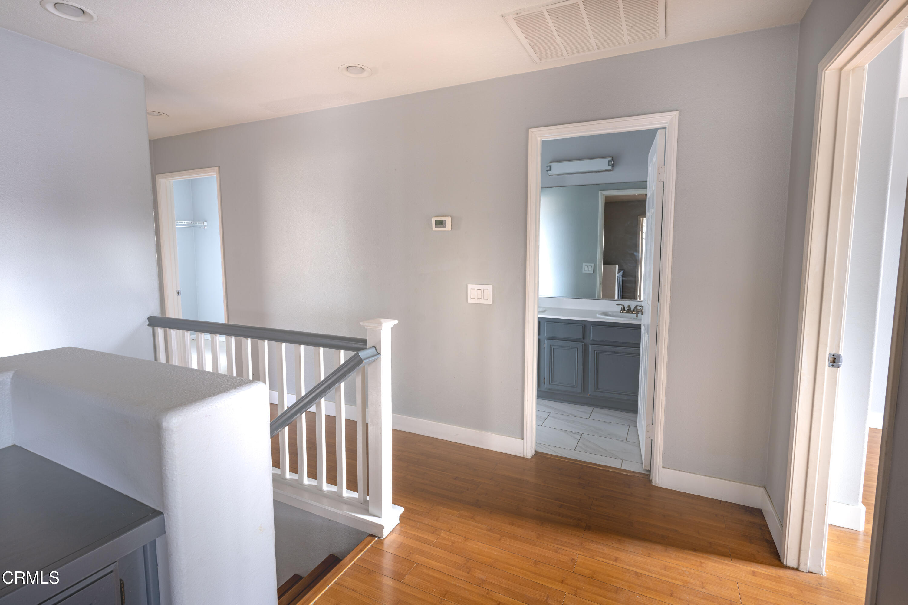 732 Pontoon Way Oxnard, CA 93035 - Photo 7 of 15 a view of a hallway with wooden floor and staircase
