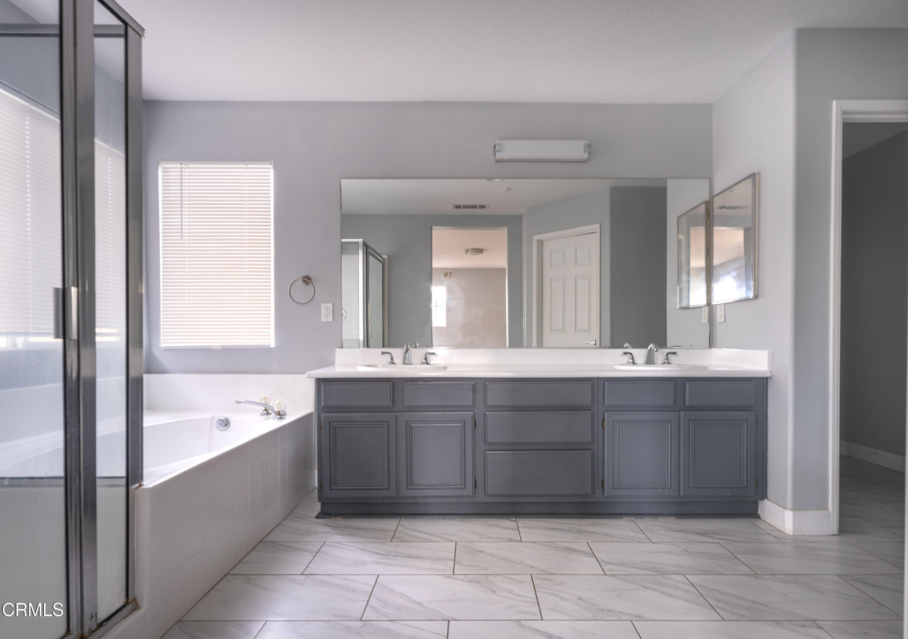 732 Pontoon Way Oxnard, CA 93035 - Photo 10 of 15 a spacious bathroom with a tub sink and mirror