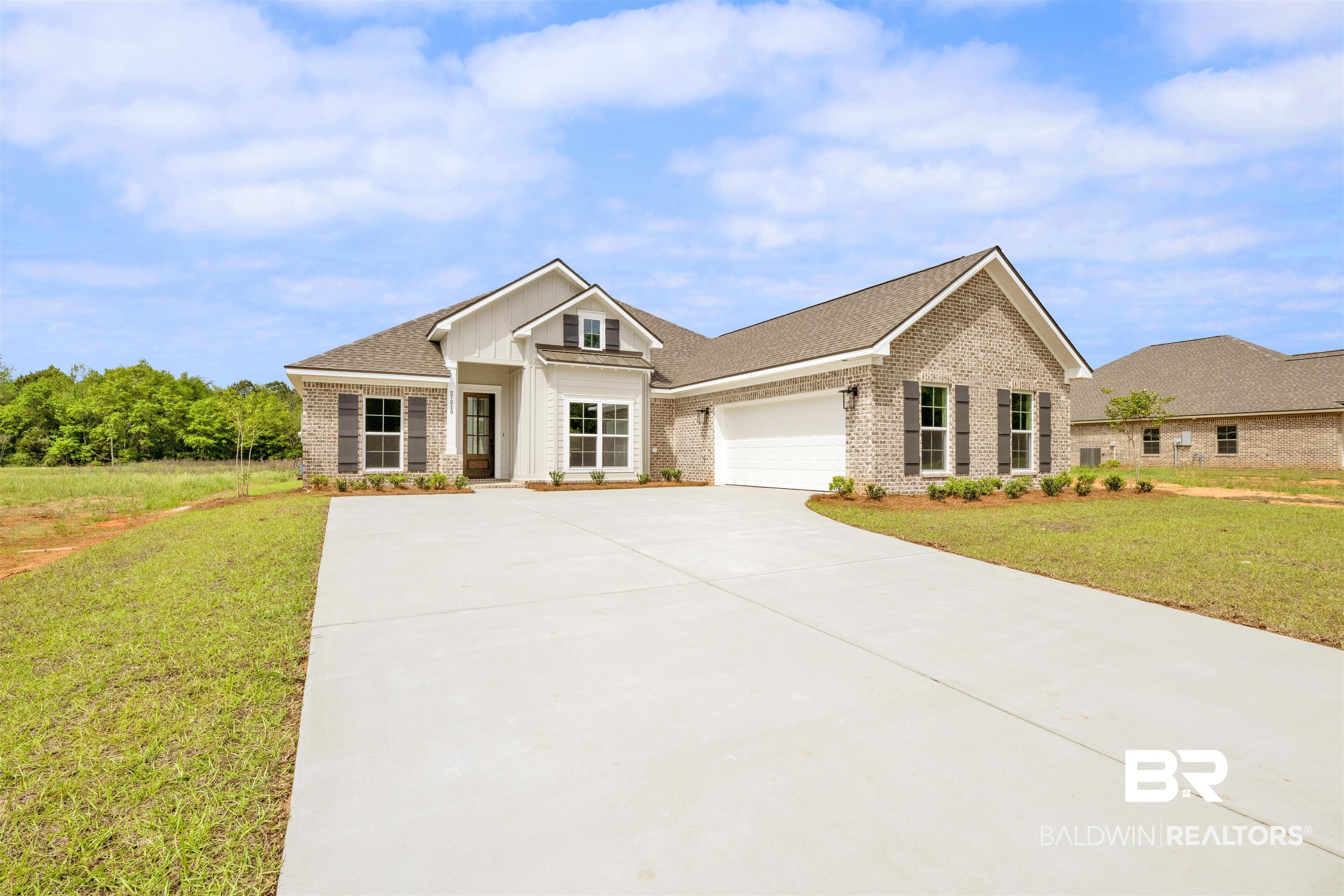 27315 Patch Pl Loop Daphne, AL 36526 - Photo 2 of 43 Craftsman-style house with a front yard, brick siding, an attached garage, and driveway