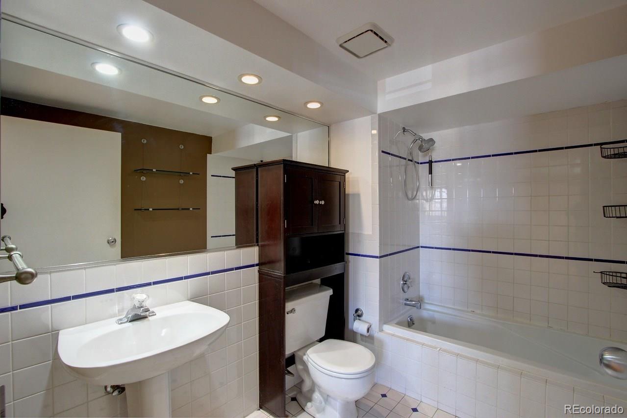 3377 Blake Street, Unit 202 Denver, CO 80205 - Photo 11 of 19 a bathroom with a sink toilet and shower