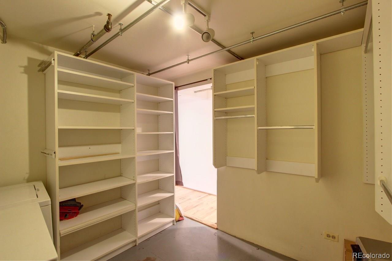 3377 Blake Street, Unit 202 Denver, CO 80205 - Photo 12 of 19 a view of walk in closet with empty racks