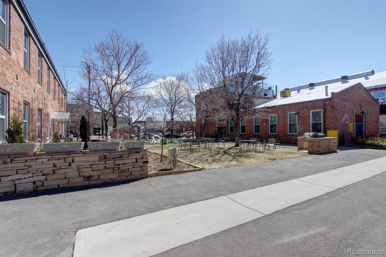 3377 Blake Street, Unit 202 Denver, CO 80205 - Photo 19 of 19 a street view with residential house