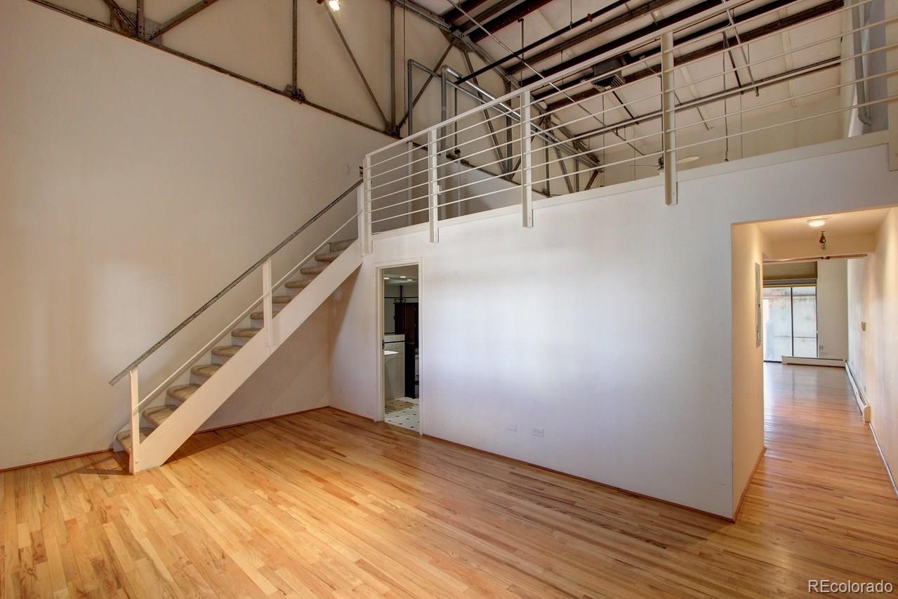 3377 Blake Street, Unit 202 Denver, CO 80205 - Photo 7 of 19 a view of a room with wooden floor