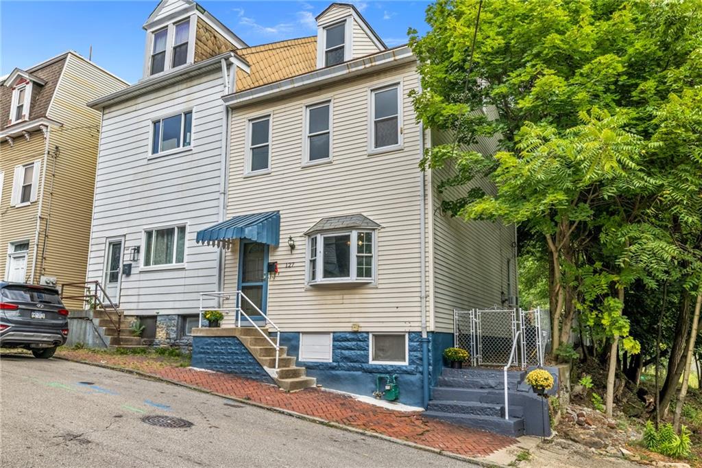 a front view of a house with garage