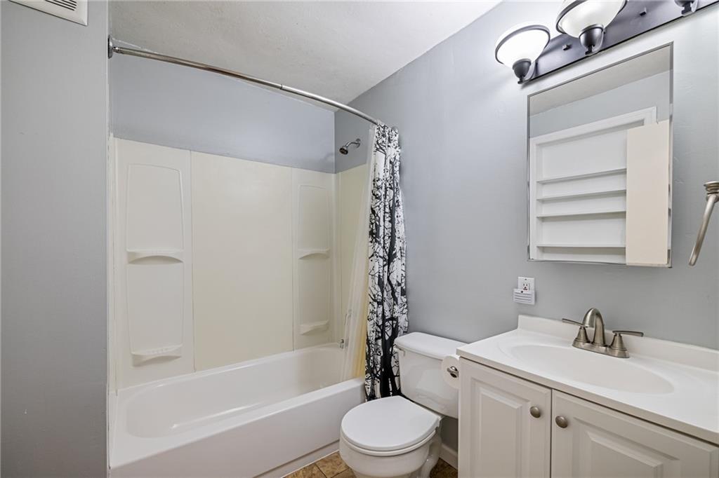127 Fountain Street Pittsburgh, PA 15212 - Photo 12 of 25 a bathroom with a sink a toilet and shower