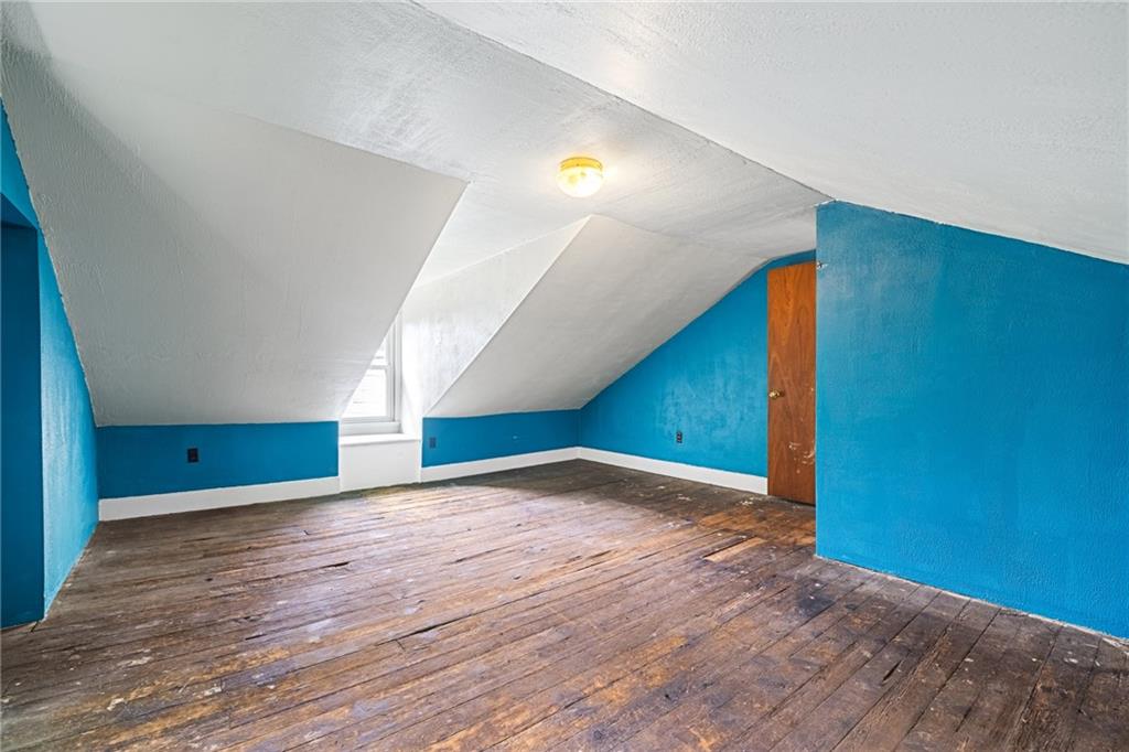 127 Fountain Street Pittsburgh, PA 15212 - Photo 19 of 25 a view of an empty room with wooden floor
