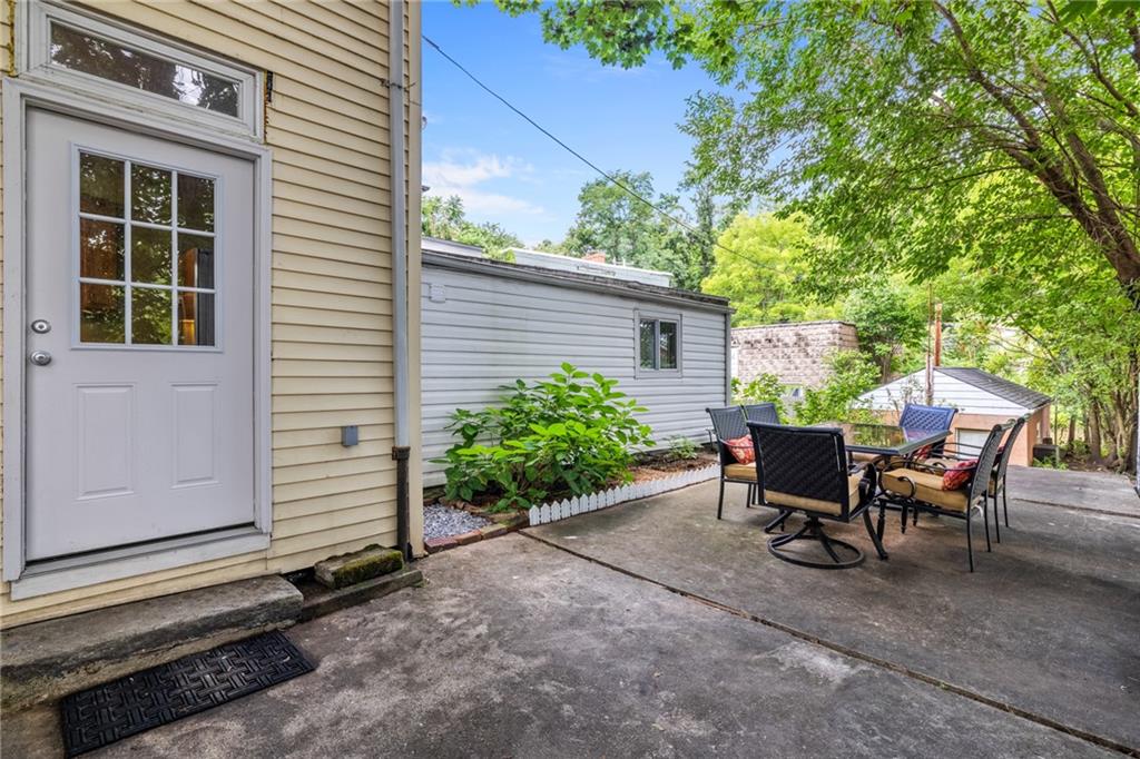 127 Fountain Street Pittsburgh, PA 15212 - Photo 20 of 25 a view of a house with a backyard and sitting area