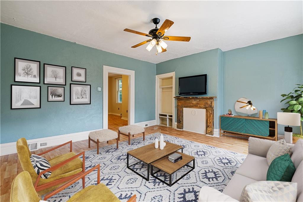 127 Fountain Street Pittsburgh, PA 15212 - Photo 2 of 25 a living room with furniture a flat screen tv and a window