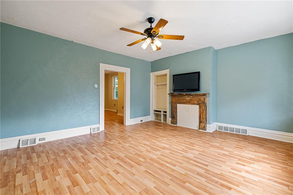 127 Fountain Street Pittsburgh, PA 15212 - Photo 3 of 25 a view of an empty room with a ceiling fan and a window