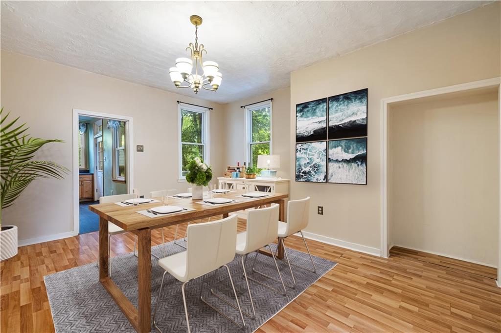 127 Fountain Street Pittsburgh, PA 15212 - Photo 4 of 25 a view of a dining room with furniture window and wooden floor