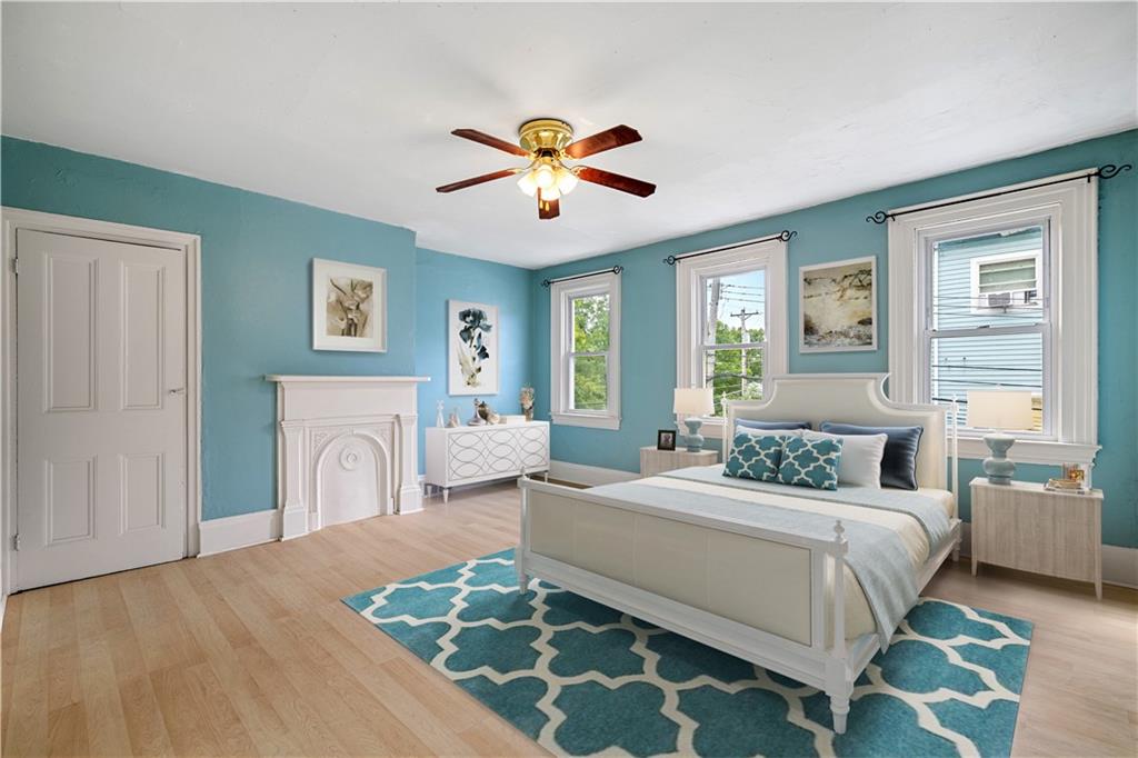 127 Fountain Street Pittsburgh, PA 15212 - Photo 10 of 25 a bedroom with a large bed couch and a window