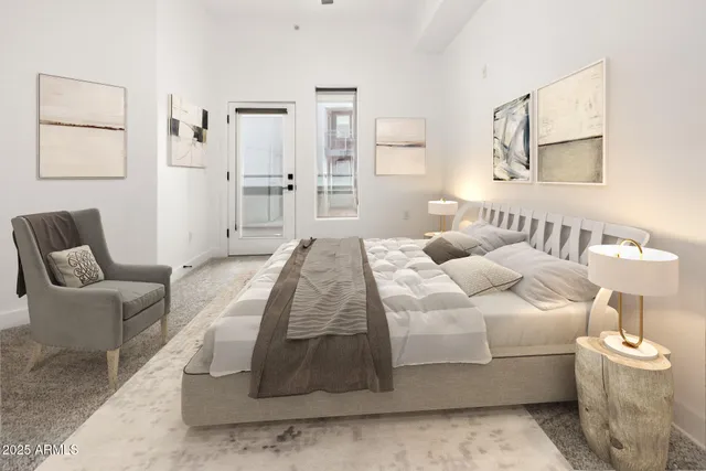 a bedroom with a bed and a couch