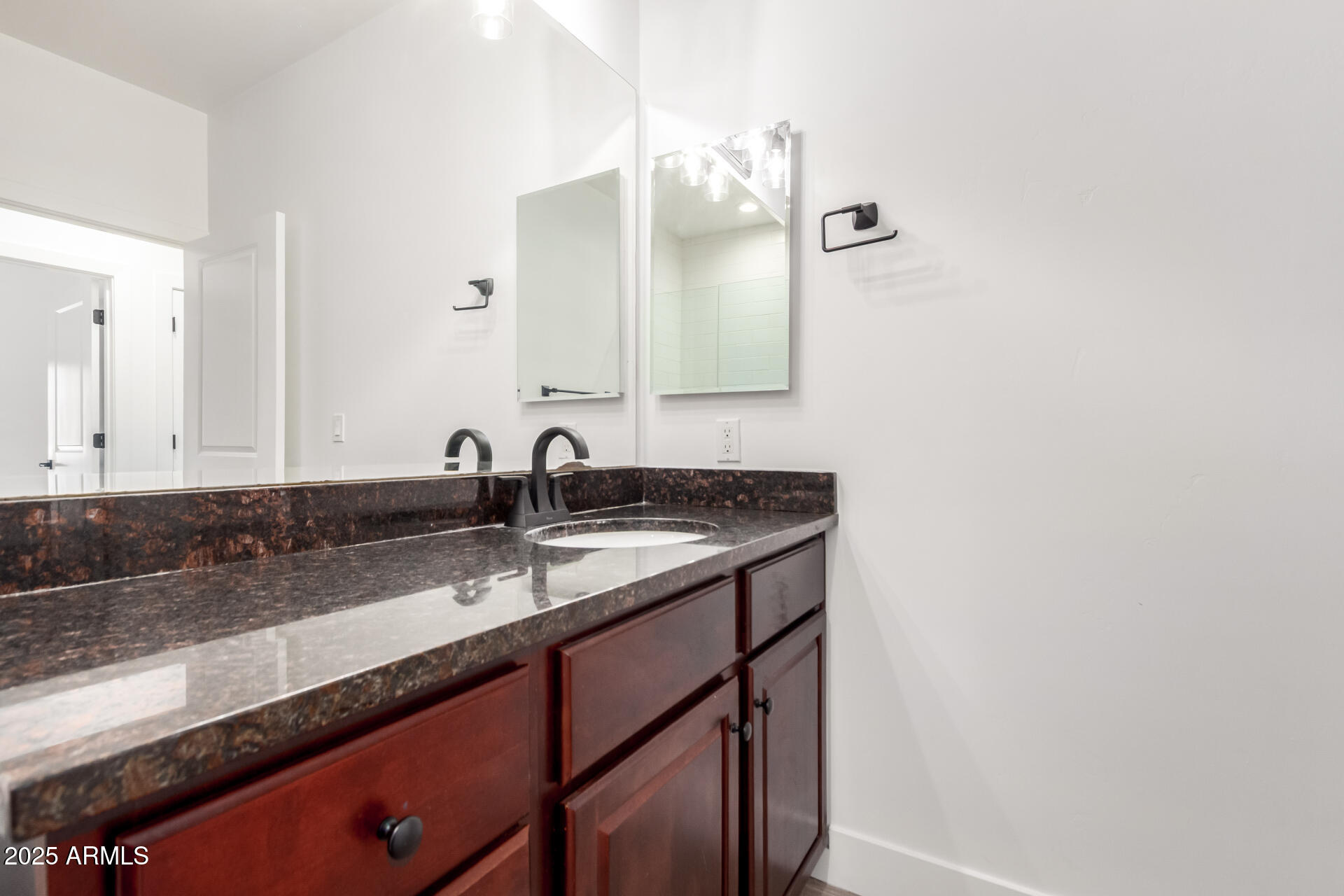 945 East Playa Del Norte Drive, Unit 4020 Tempe, AZ 85288 - Photo 17 of 39 a bathroom with a sink and a mirror