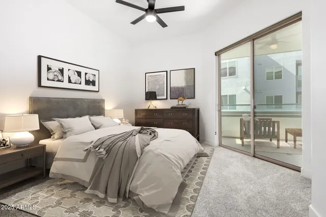 a bedroom with a bed and glass walk in closet