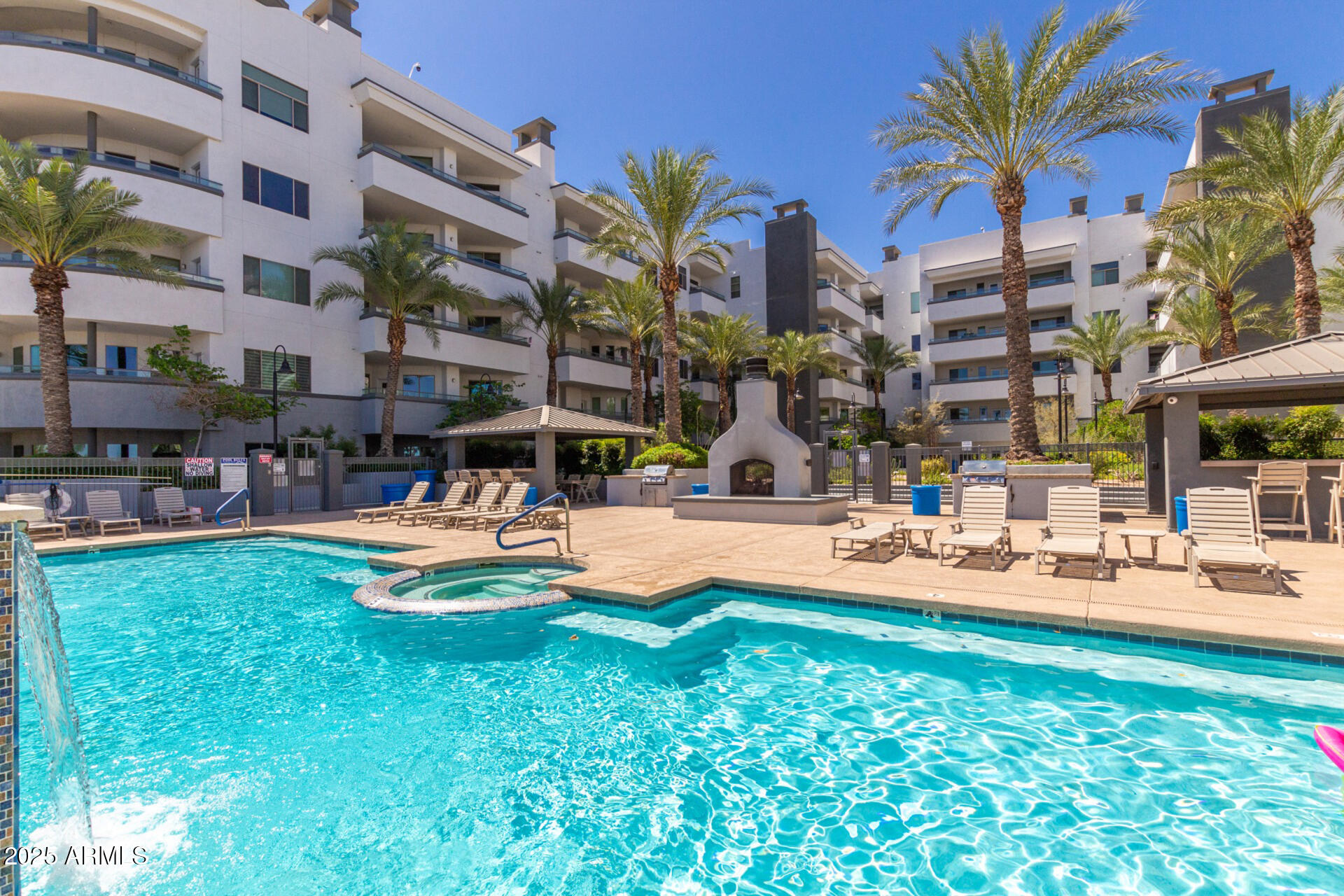 945 East Playa Del Norte Drive, Unit 4020 Tempe, AZ 85288 - Photo 28 of 39 a swimming pool with outdoor seating and yard