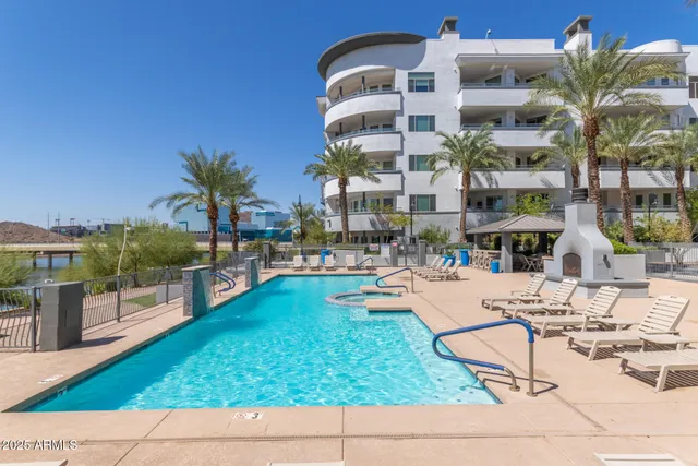 a view of a swimming pool and lounge chair