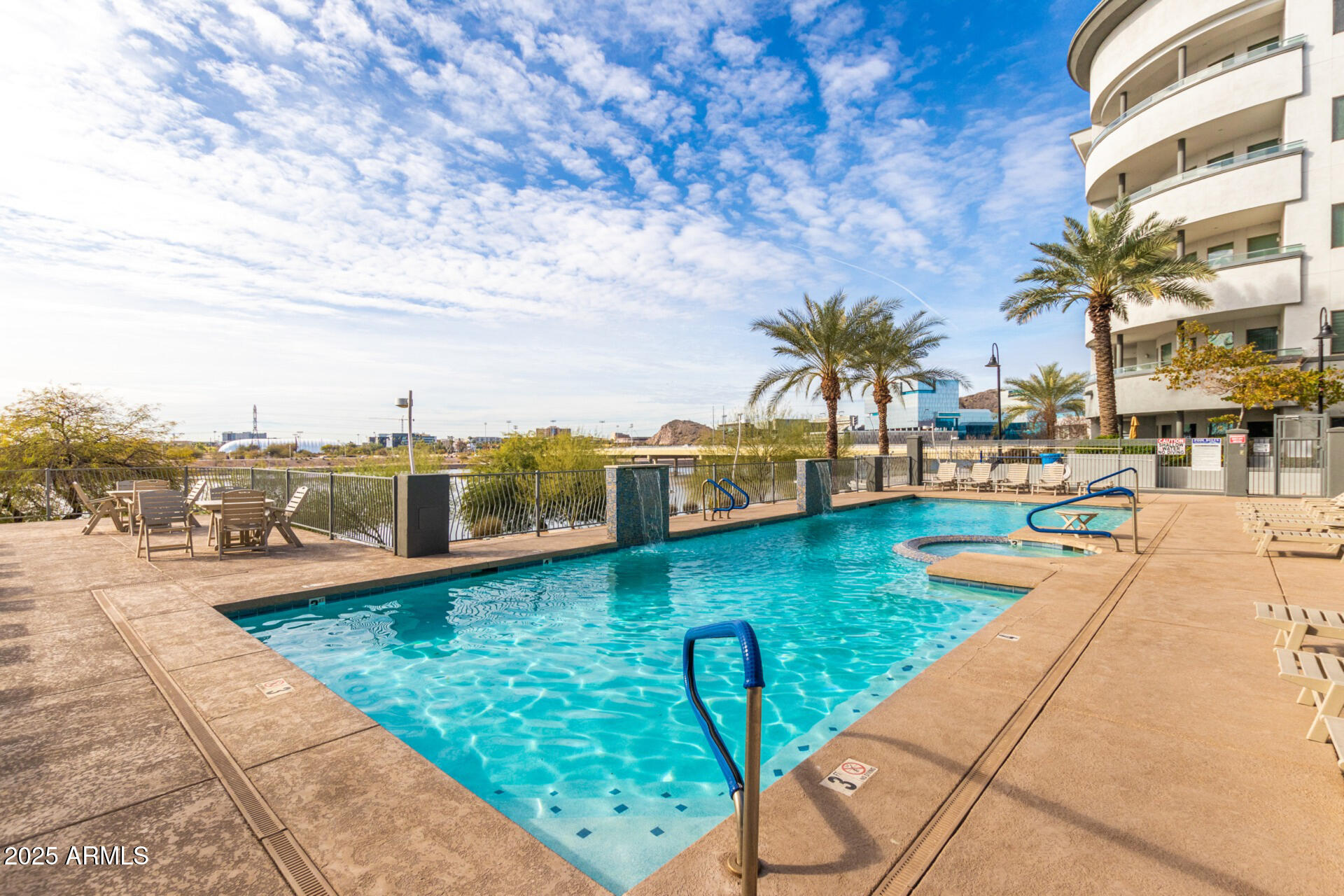 945 East Playa Del Norte Drive, Unit 4020 Tempe, AZ 85288 - Photo 31 of 39 a view of a swimming pool and lounge chair