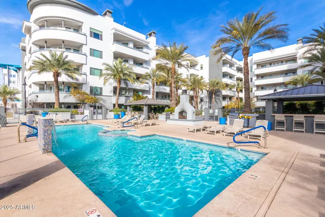 a view of a patio with table and chairs and potted plants