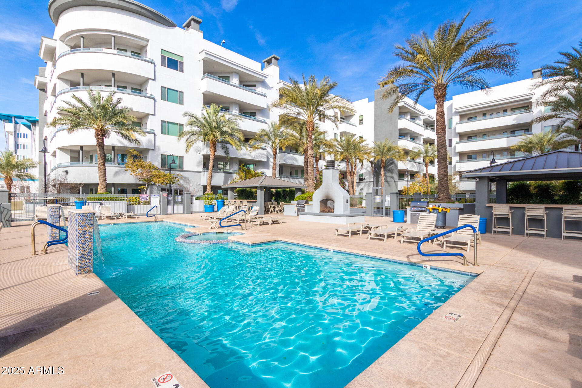 945 East Playa Del Norte Drive, Unit 4020 Tempe, AZ 85288 - Photo 32 of 39 a view of a building with a swimming pool