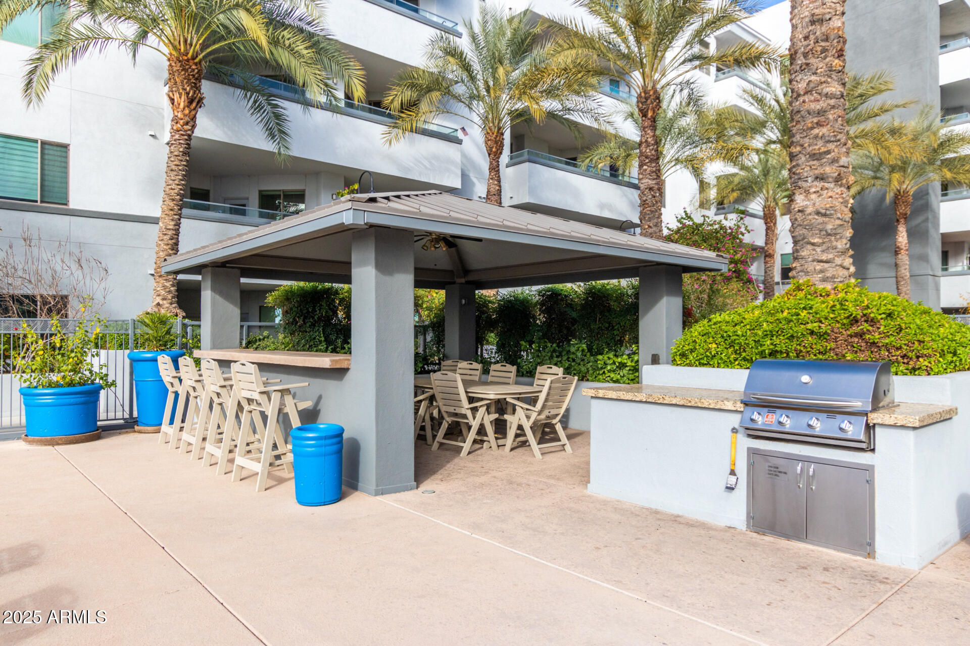 945 East Playa Del Norte Drive, Unit 4020 Tempe, AZ 85288 - Photo 33 of 39 a view of a patio with table and chairs and potted plants