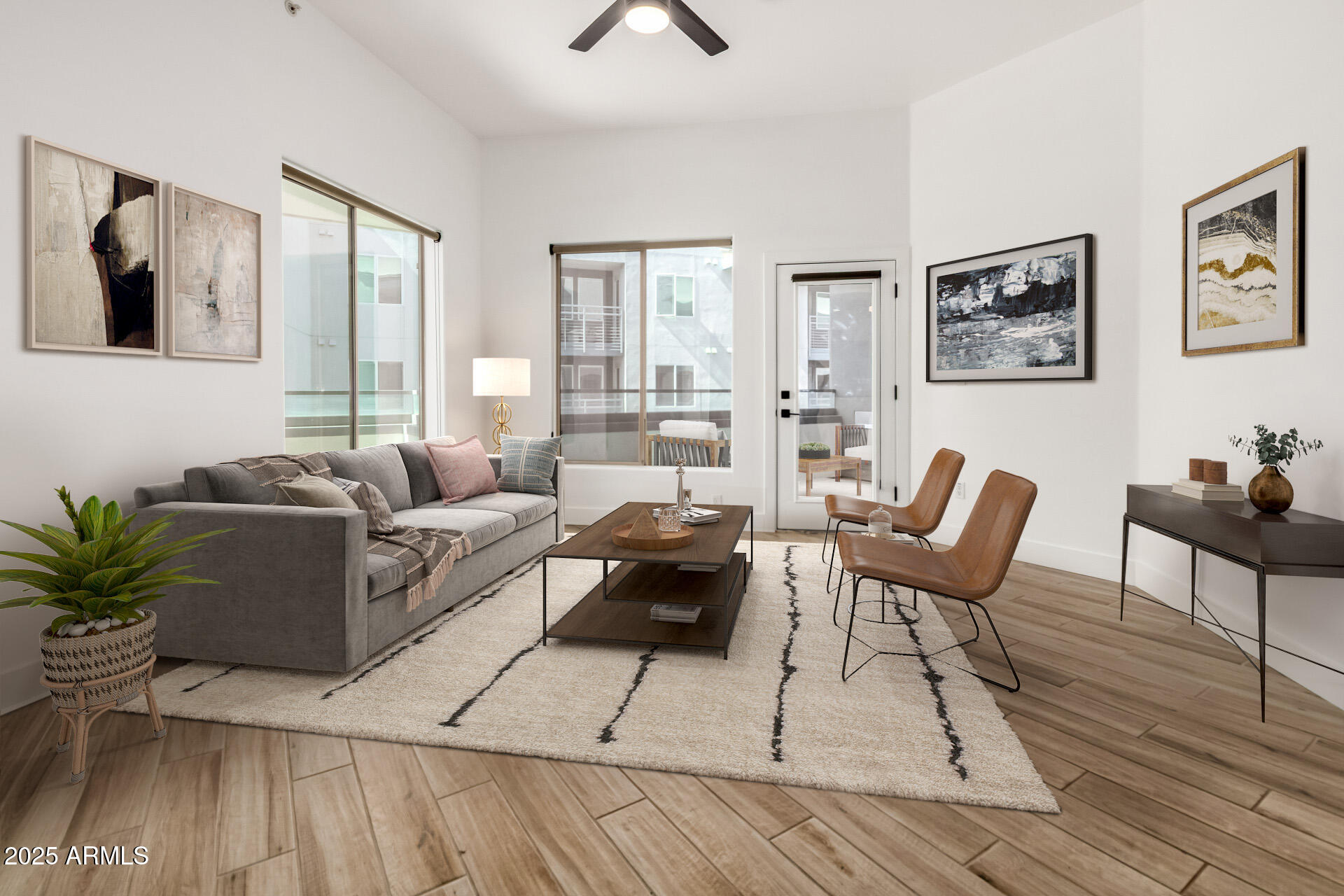 945 East Playa Del Norte Drive, Unit 4020 Tempe, AZ 85288 - Photo 5 of 39 a living room with furniture and wooden floor