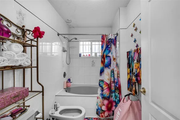 a bathroom with a sink mirror and vanity