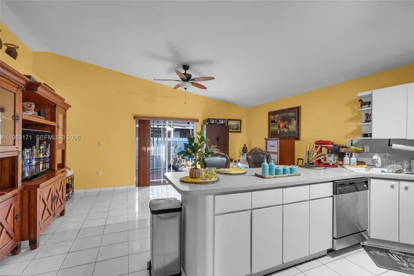 a kitchen that has a sink and cabinets