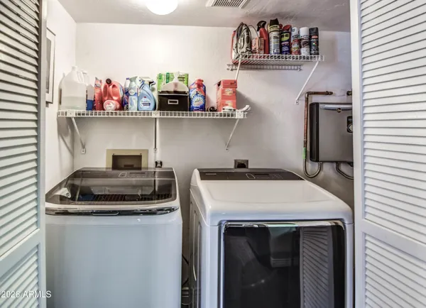 a kitchen with a stove and cabinets