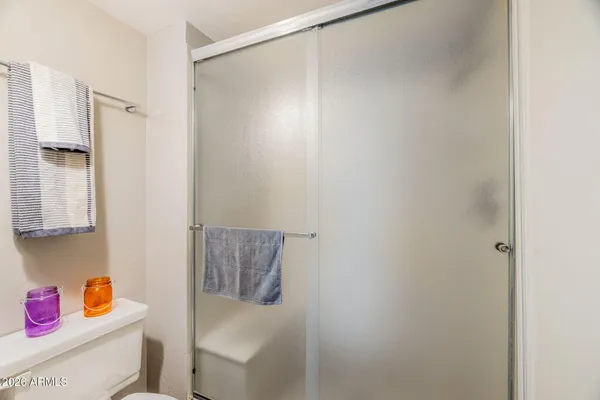 a bathroom with a shower curtain and a sink