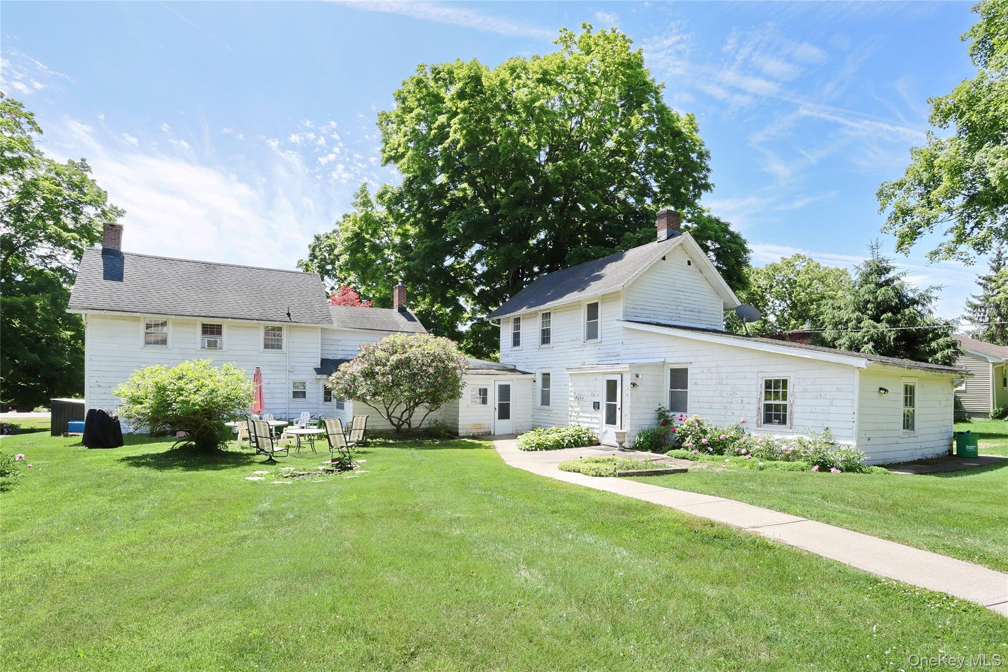 500 Haverstraw Road Suffern, NY 10901 - Photo 2 of 36 a front view of a house with a yard and trees
