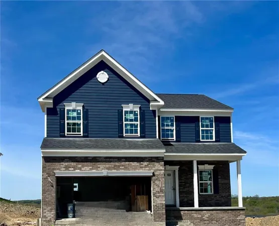 a front view of a house with yard